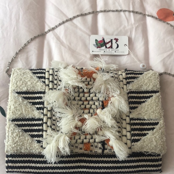 America and Beyond Handbags - Boho clutch with pom poms